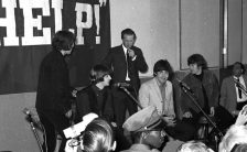 The Beatles with press officer Tony Barrow, 1965