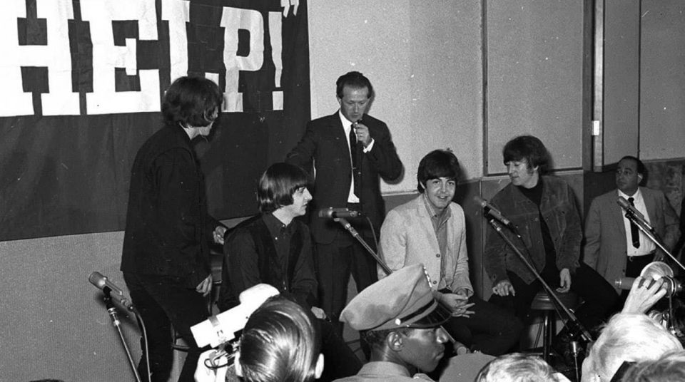 The Beatles with press officer Tony Barrow, 1965