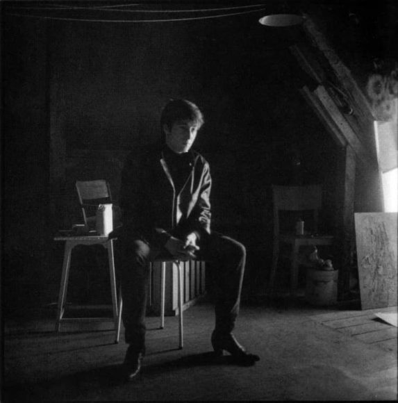 John Lennon in Stuart Sutcliffe's art studio at Astrid Kirchherr's house, 1962