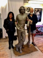 Laura-Lian-and-Michael-Eavis-with-JLP-statue.jpg