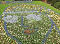 a-flower-bed-display-of-planted-bulbs-featuring-the-visage-of-john-lennon-in-glasses-for-the-flower-power-theme-at-the-2019-keukenhof-tulip-festival-T4H5A4-1.jpg